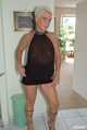 Blonde mature Claudia stipping out of a black dress 5