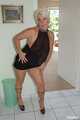 Blonde mature Claudia stipping out of a black dress 6
