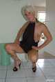 Blonde mature Claudia stipping out of a black dress 7