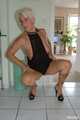 Blonde mature Claudia stipping out of a black dress 8