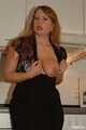 Chubby redhead  Benita stripping out of her black dress in the kitchen 6