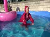 Watch Sandra watering the garden and wetting her shiny nylon oldschool Rainsuit in the Pool 10