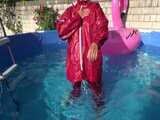 Watch Sandra watering the garden and wetting her shiny nylon oldschool Rainsuit in the Pool 6