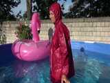 Watch Sandra watering the garden and wetting her shiny nylon oldschool Rainsuit in the Pool 7