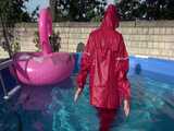 Watch Sandra watering the garden and wetting her shiny nylon oldschool Rainsuit in the Pool 8