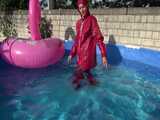 Watch Sandra watering the garden and wetting her shiny nylon oldschool Rainsuit in the Pool 9