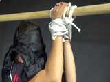 Watch Sandra bound and gagged in her shiny nylon Shorts riding a wooden Pony 10