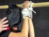 Watch Sandra bound and gagged in her shiny nylon Shorts riding a wooden Pony 9