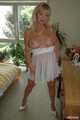 Busty blonde Marlen posing in a white negligee in the bedroom 8