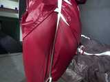 Watch Sandra beeing bound gagged and pantyhooded in her shiny nylon Rainwear 6