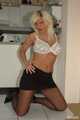 Blonde and busty business woman Martina stripping out of her white shirt, black skirt and pantyhose 5